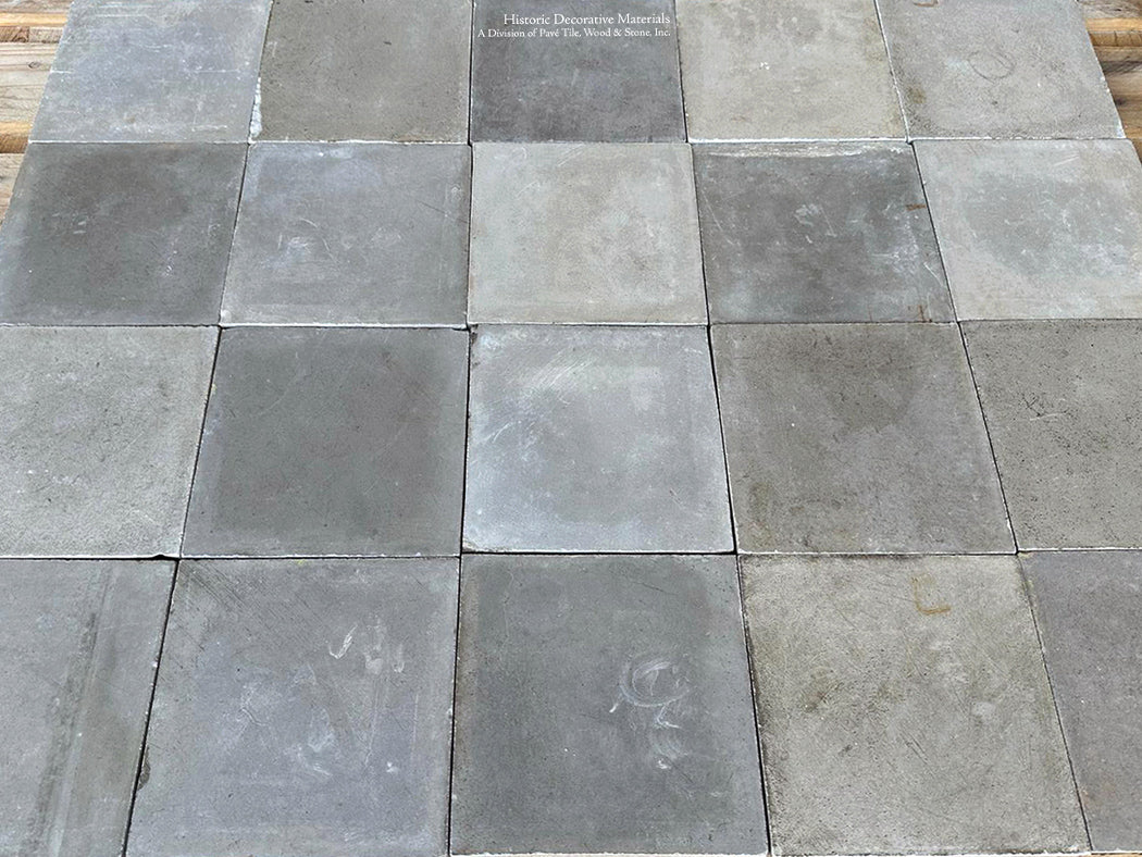 The French gray colors of this antique cement tile from France is lovely.