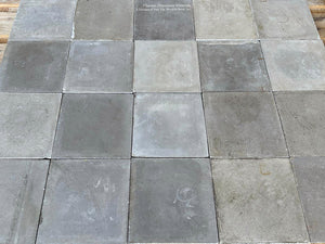 The French gray colors of this antique cement tile from France is lovely.