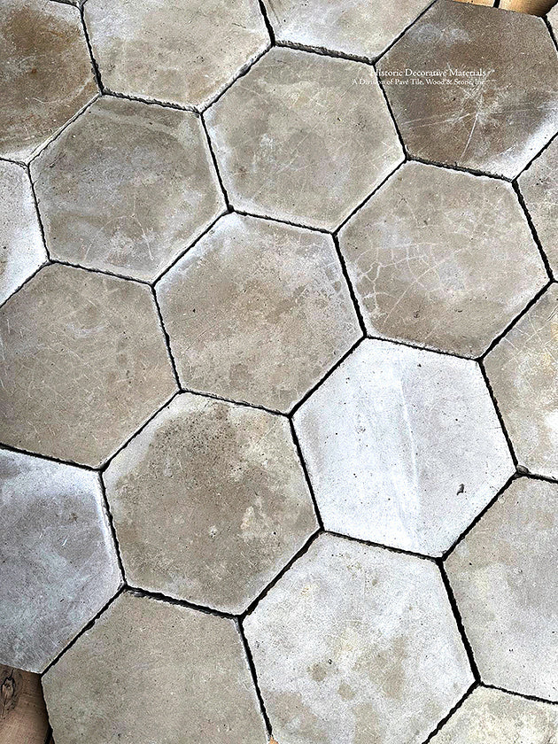 The texture and patina of this antique ivory Belgian hexagon cement tile will add old world luxury to an entryway.