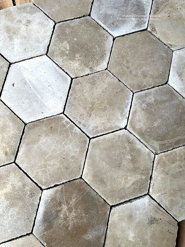 A primary bath showcasing this antique ivory Belgian hexagon cement tile would marry gracefully with marble countertops.