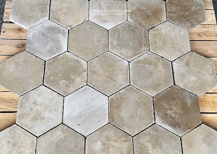 Hand-molded antique Belgian cement tile hexagons define luxury, historic interiors.