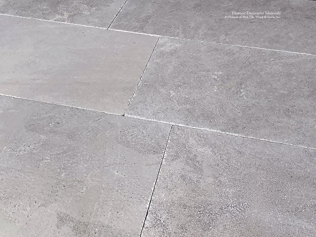 Antiqued French Limestone Flooring | Neutral Beige Patina for nuanced interiors.