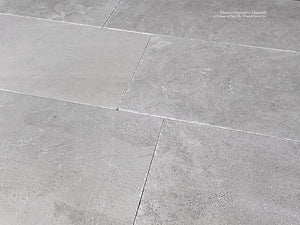 Antiqued French Limestone Flooring | Neutral Beige Patina for nuanced interiors.