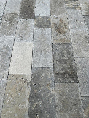 Authentic French limestone flooring Lot with weathered limestone, fossilized detail, and timeless architectural beauty
