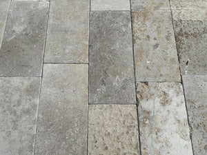 Luxury French limestone flooring Quercy with weathered taupe, ash undertones, and Old World character