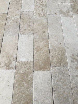 Luxury French limestone flooring Périgord with weathered limestone texture and soft ash undertones