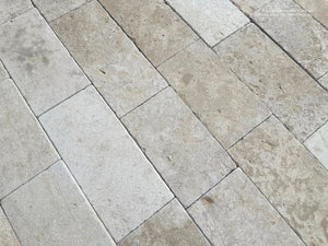 Antiqued French limestone flooring Périgord with weathered chalk limestone and fossilized surface
