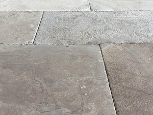 Antiqued French Limestone Flooring | Artisanally crafted for luxury interiors.