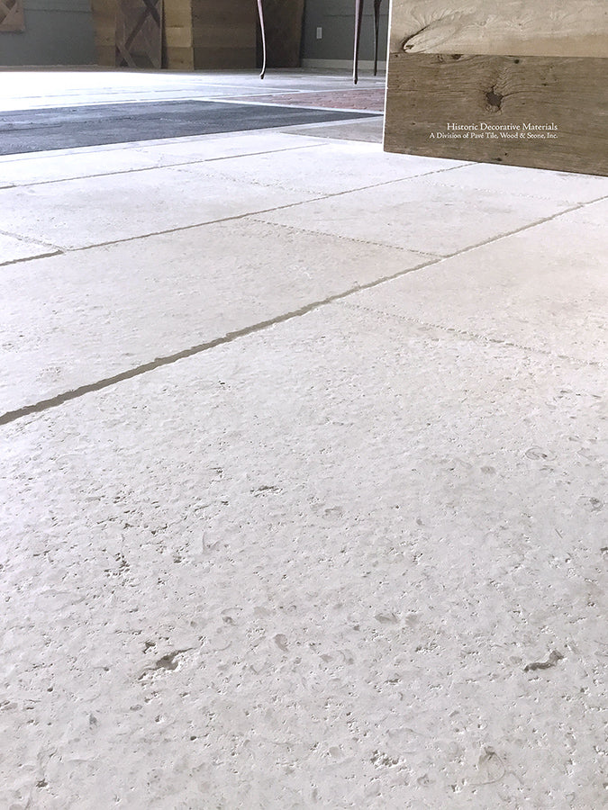 Antiqued French Limestone Flooring | Hand hammered patina creates dimension and authenticity.