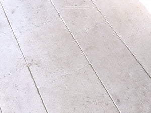 Antiqued French Limestone Floors | White Limestone adds luxury to elegant kitchens.