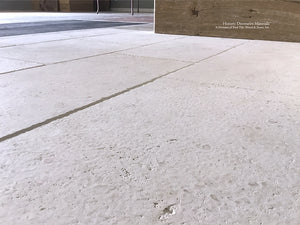 Antiqued French Limestone Flooring | Surface patina softens white limestone color palette.