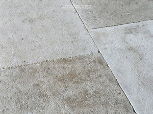 Antiqued French Limestone flooring with hand-finished patina is a beautiful floor.