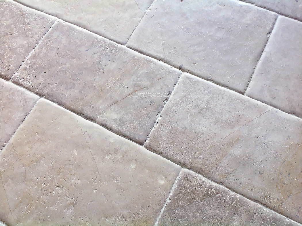 Antiqued French limestone flooring | hand-finished satin patina.