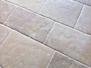 Antiqued French limestone flooring | hand-finished satin patina.
