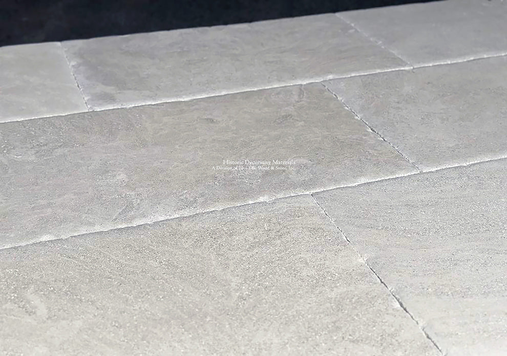 Hand-finished antique French limestone floors reveals a smooth, satin patina.