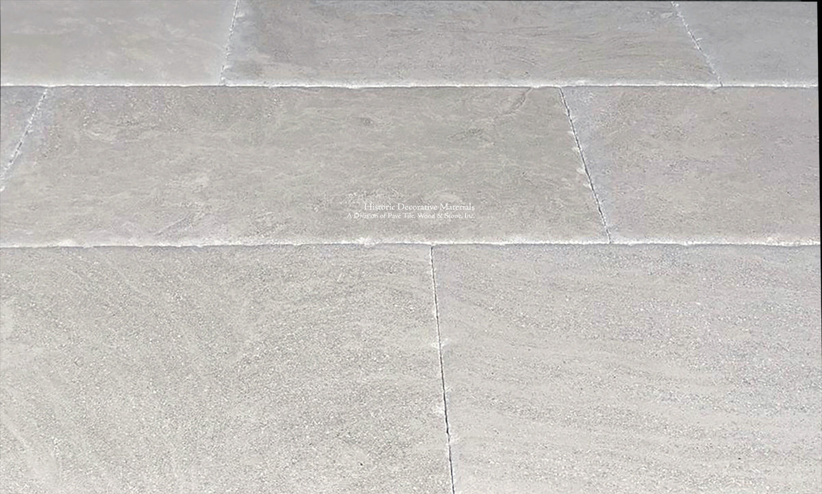 The beautiful underlations of antiqued French limestone floors reveal an elegance for period homes.