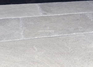 The satin patina of antique French limestone floors brings forth elegance for carriage houses and Brownstones.