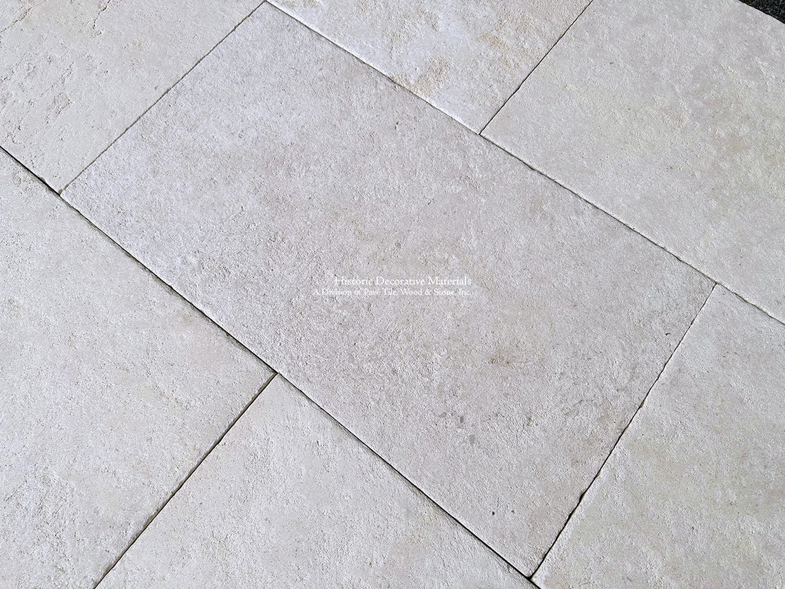 Antiqued French Limestone Flooring | Creamy whites and cool whites add archtiectural nuance to a floor.