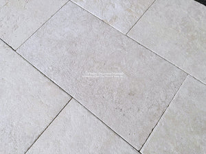 Antiqued French Limestone Flooring | Creamy whites and cool whites add archtiectural nuance to a floor.