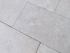 Antiqued French Limestone Flooring | Beautiful white limestone colors for a luxury kitchen floor.