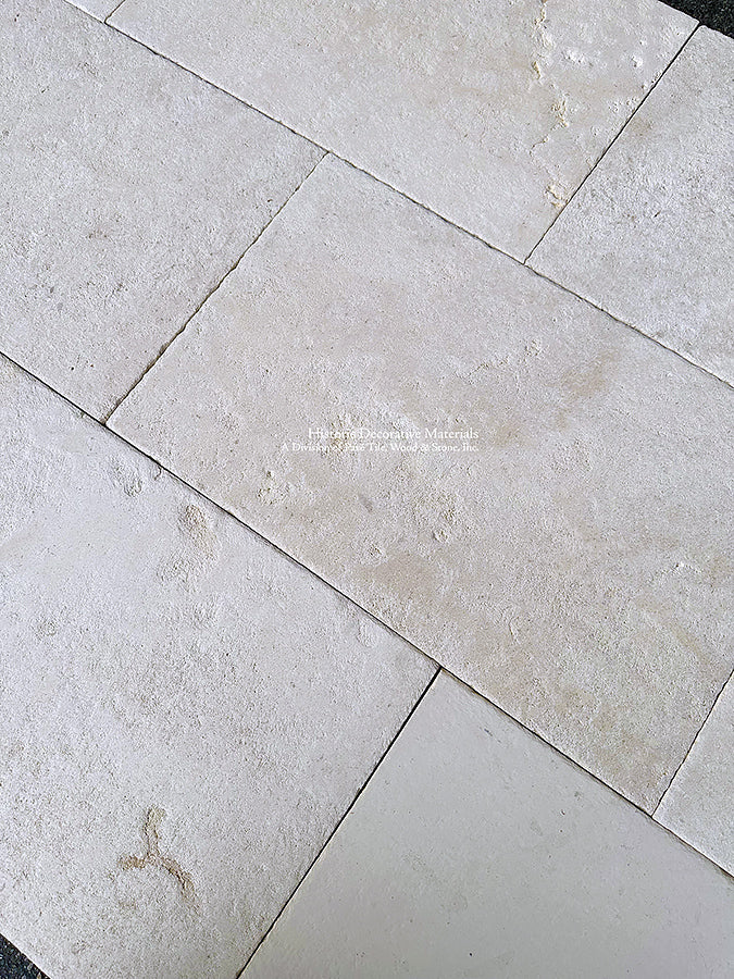 Antiqued French Limestone Flooring | Beautiful white limestone colors for a luxury kitchen floor.