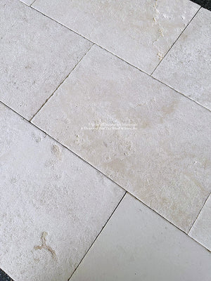 Antiqued French Limestone Flooring | Beautiful white limestone colors for a luxury kitchen floor.