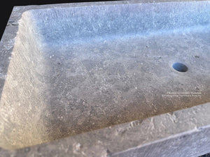 Large carved limestone sink for French country bathroom interior