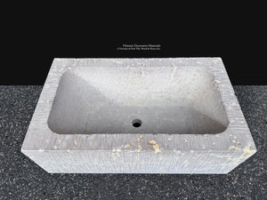 Antiqued limestone sink inspired by historic French farmhouse stone troughs