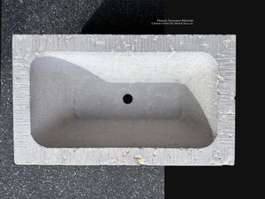 Hand-carved French limestone basin with chiseled surface and aged patina
