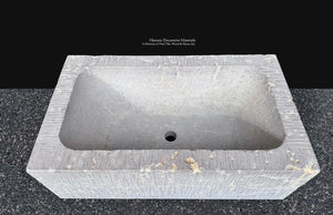 Cloister Stone limestone vessel with soft gray tones and authentic fossil texture