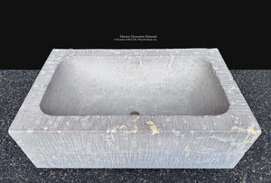 Large carved stone sink with substantial proportions for historic home design