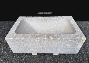 French limestone trough basin featuring organic mineral deposits and natural variation