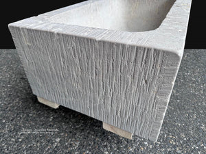 Antiqued architectural limestone vessel for bespoke kitchen and bath design