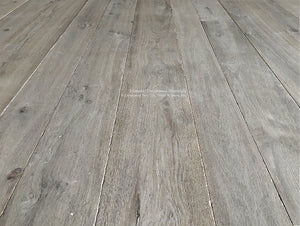 Antiqued French Oak floors installed in bedrooms carry historic rensonance.