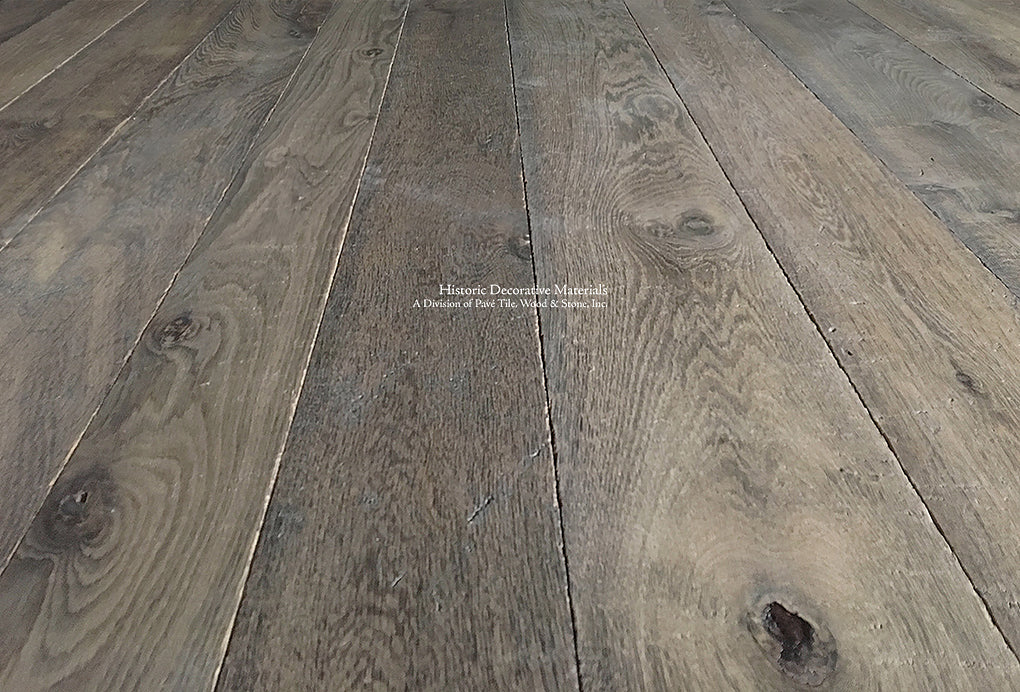Antiqued French Oak Flooring | A mixture of warm oak and gray oak hues define this patina.