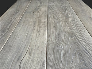 The wide-planks of our antiqued French gray oak floors are an artisanal masterpiece.