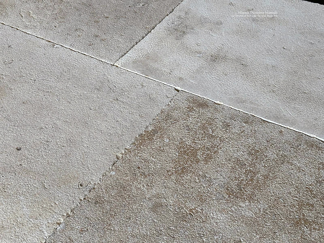 A gray, cream and oak color palette of antique French limestone floors give design options for elegant kitchens.