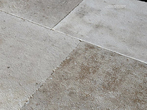 A gray, cream and oak color palette of antique French limestone floors give design options for elegant kitchens.