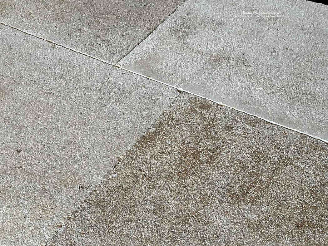 A gray, cream and oak color palette of antique French limestone floors give design options for elegant kitchens.