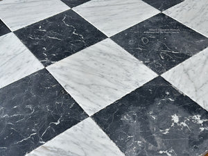 timeworn black and white marble checkerboard flooring detail has hand finished patina