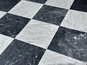 antiqued checkerboard black & white marble tile with aged surface character