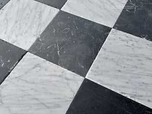 artisan antiqued checkerboard marble flooring surface rich with patina