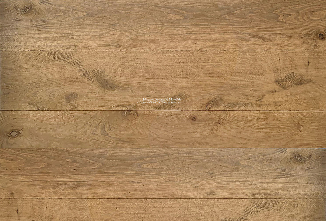 Antiqued French oak floors in patina acorn color offsets cool interiors.