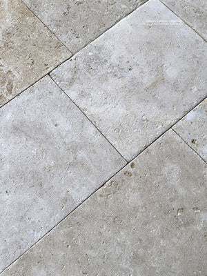 Antiqued French limestone flooring for luxury heritage interiors