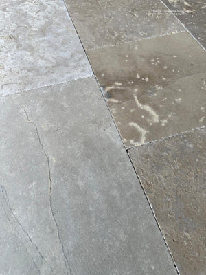 Historic limestone flooring handcrafted in France using traditional masonry techniques