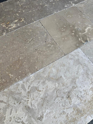 Reclaimed limestone appearance flooring with softened edges and natural patina