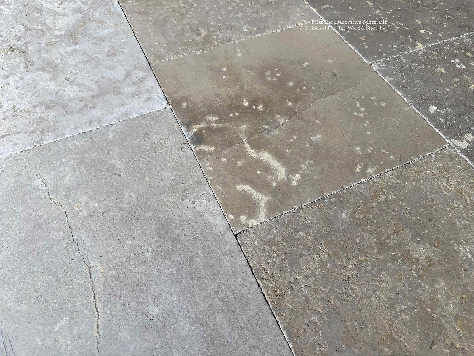 Antiqued French limestone flooring inspired by historic abbey floors of Provence