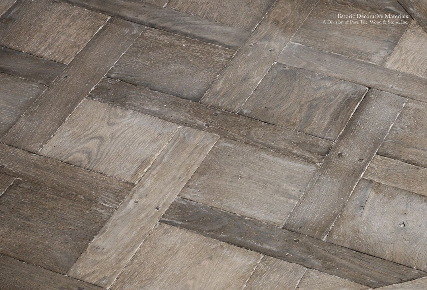 Parquet de Versailles antiqued French oak floors create Parisian decor