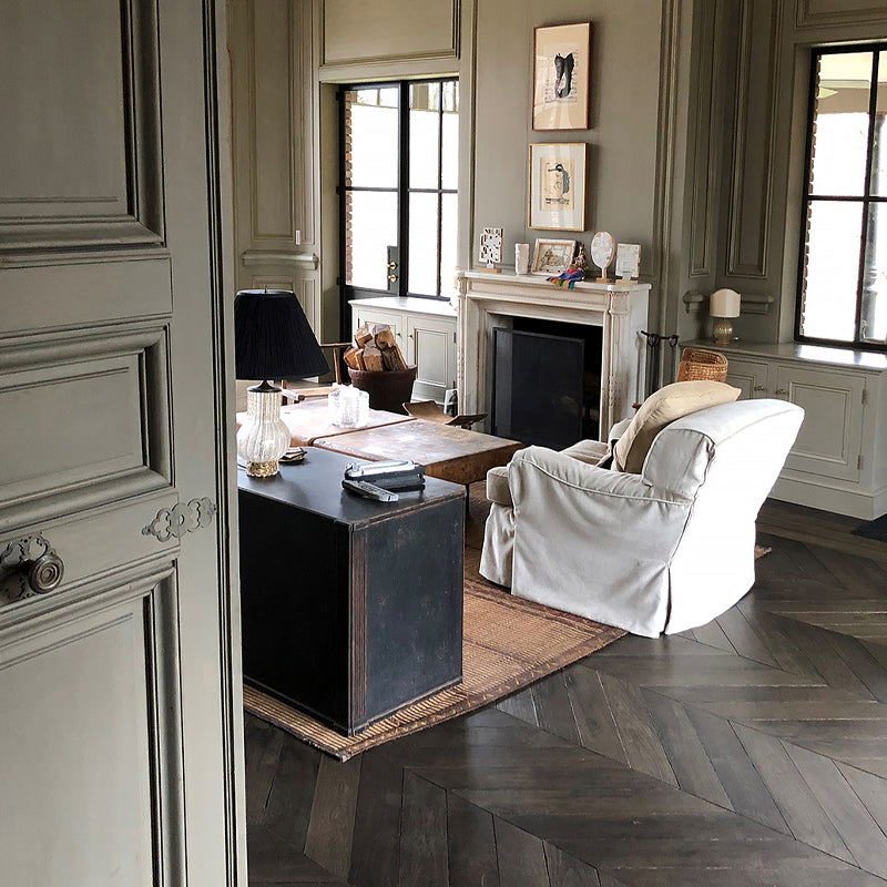Reclaimed French Oak Flooring in Chevron Pattern anchors heritage homes.