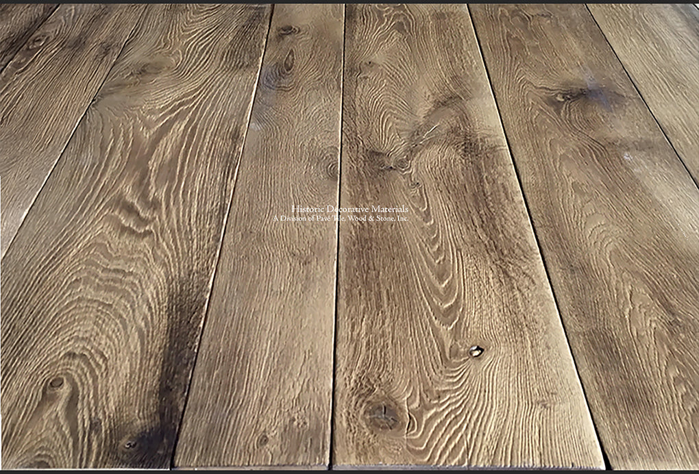 This is an antiqued French oak floor with natural and burnt oak tones.
